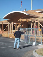 The Showhouse under construction, with the curved roof form set over the framed entry
